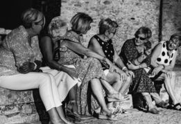 a-group-of-women-sitting-on-a-bench-with-a-panda-bear.jpg a group of women sitting on a bench with a panda bear